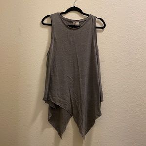 Grey tank with “shark bite” bottom. Medium